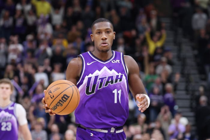 Feb 6, 2024; Salt Lake City, Utah, USA; Utah Jazz guard Kris Dunn (11) brings the ball up the court against the Oklahoma City Thunder during the fourth quarter at Delta Center.